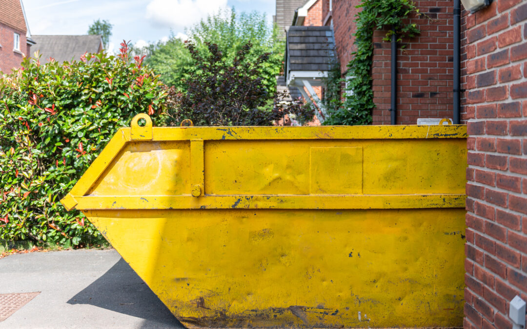 Big Yellow rubbish skip near a house